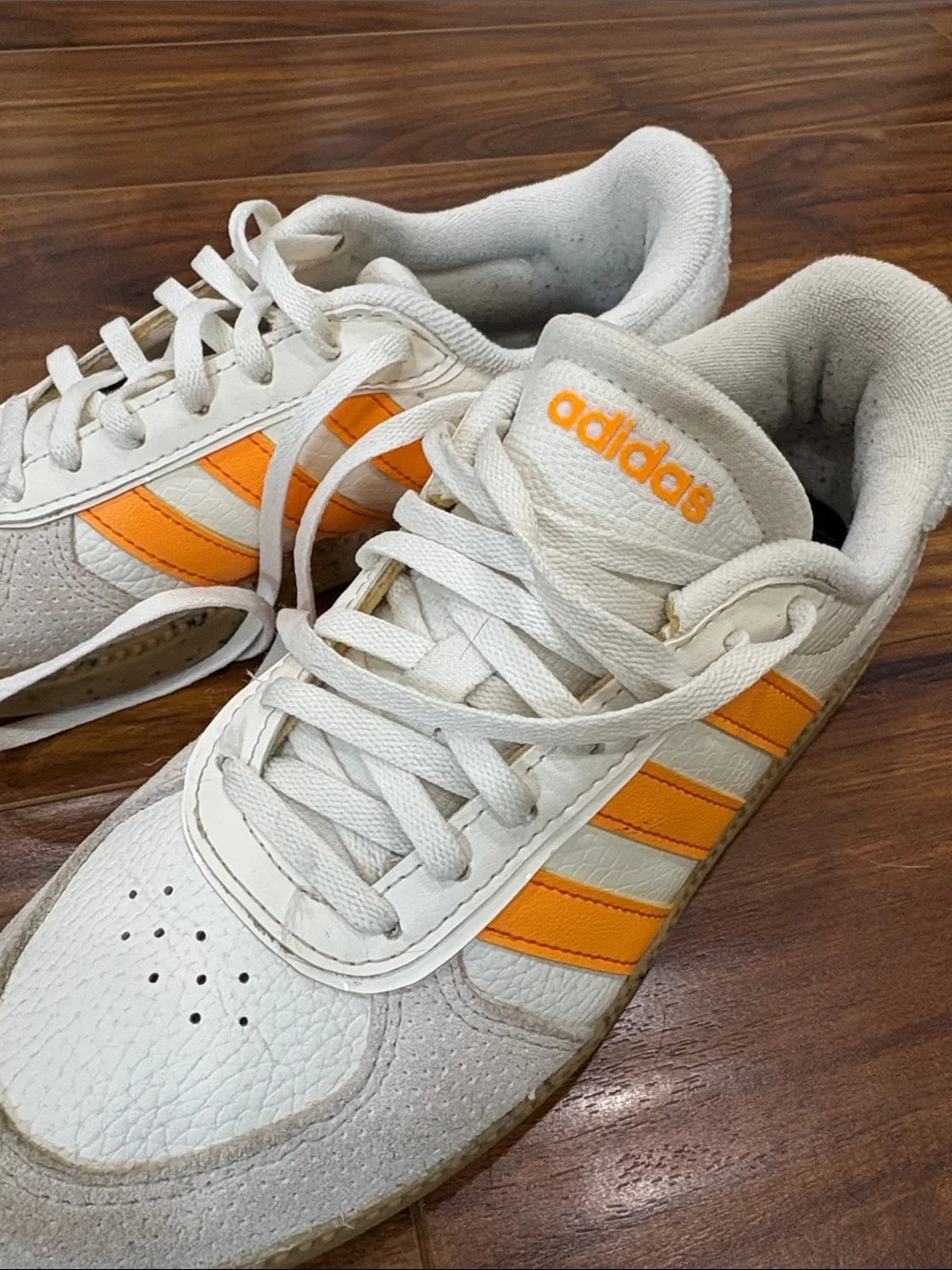 adidas Women’s White Sneakers with Orange Three-Stripes